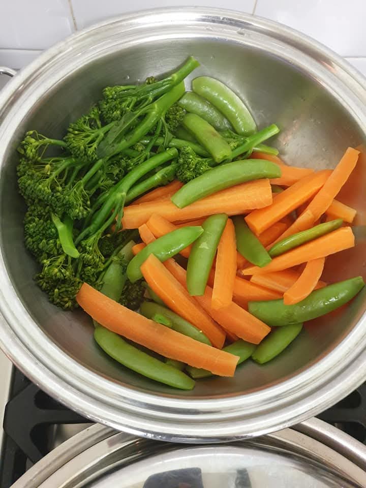 Broccoli, carrots and sugar snap peas steamed in a Saladmaster stainless steel pan without oil or water