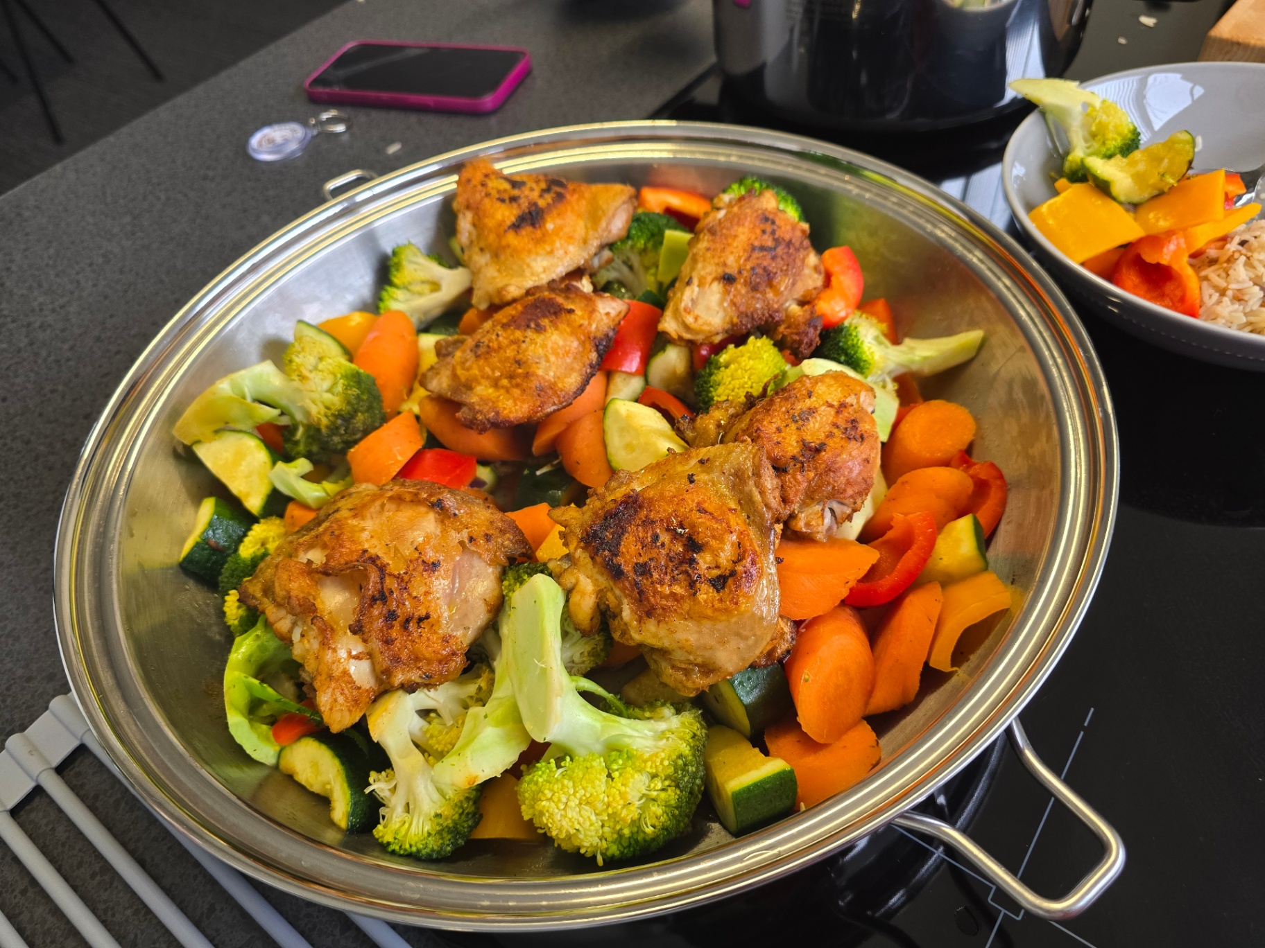 Chicken and colourful vegetables cooking in a Saladmaster pan