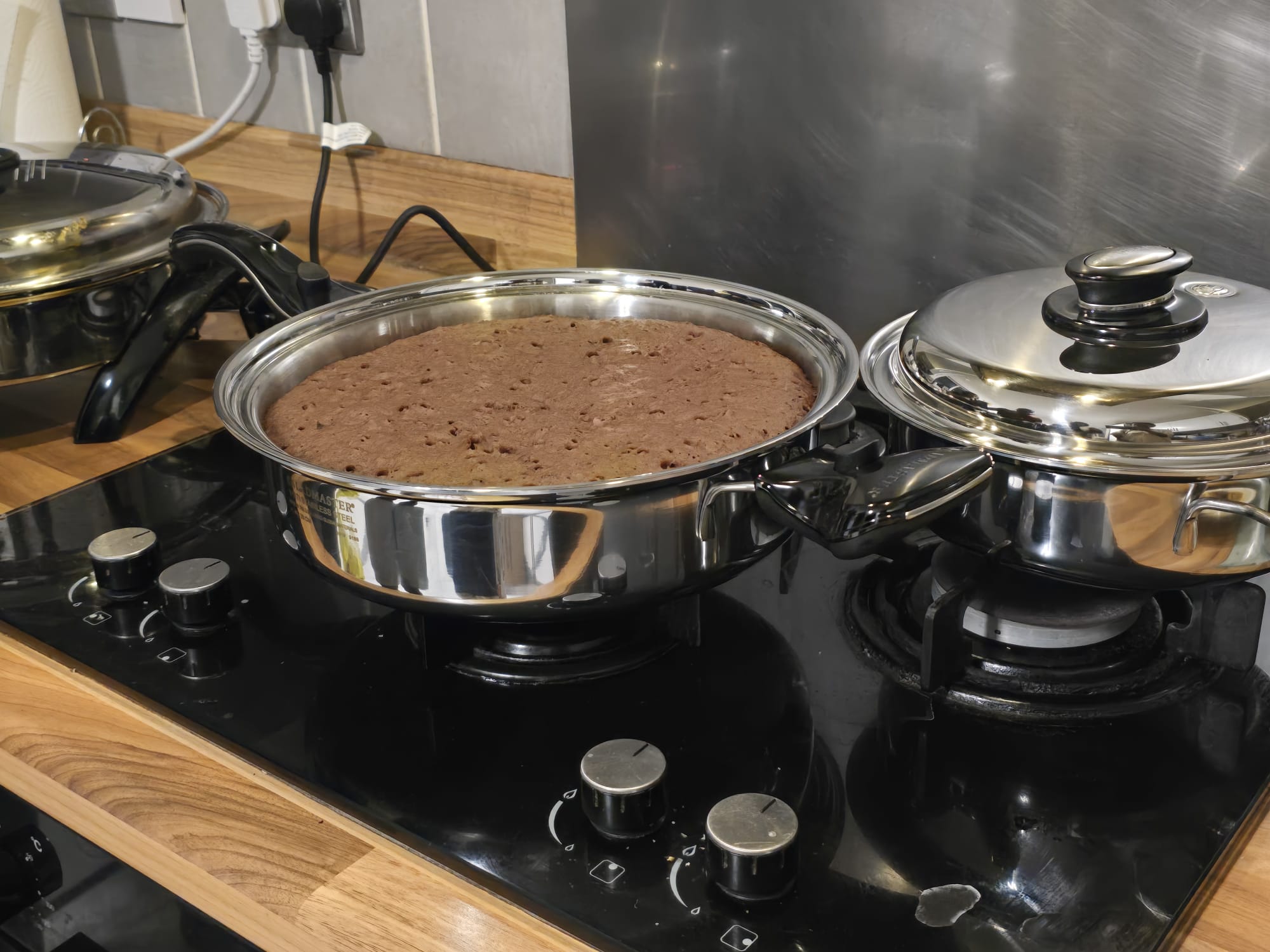 Chocolate cake baked in a Saladmaster stainless steel pan on the hob