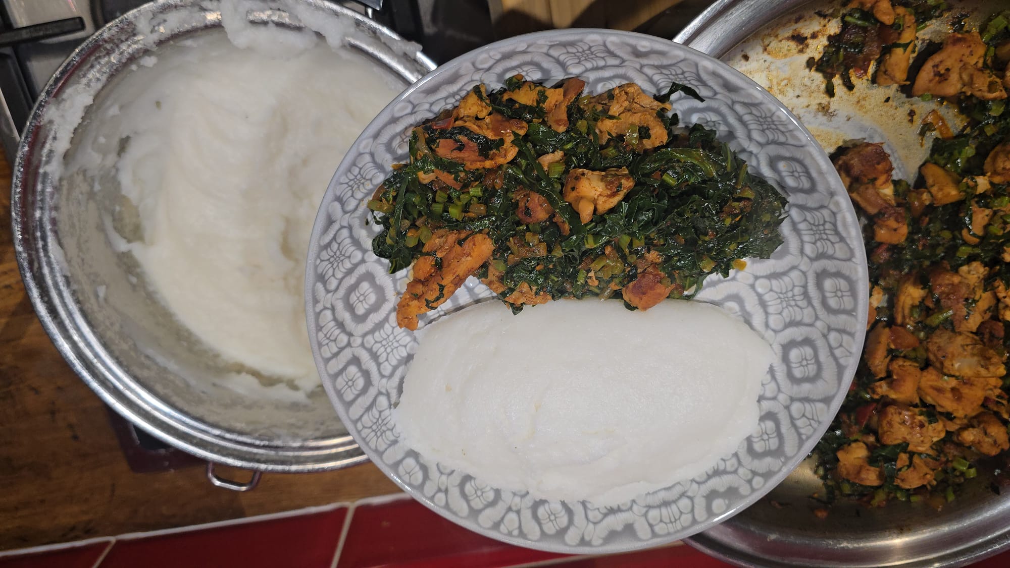 Sadza served with sautéed greens and chicken cooked in Saladmaster cookware
