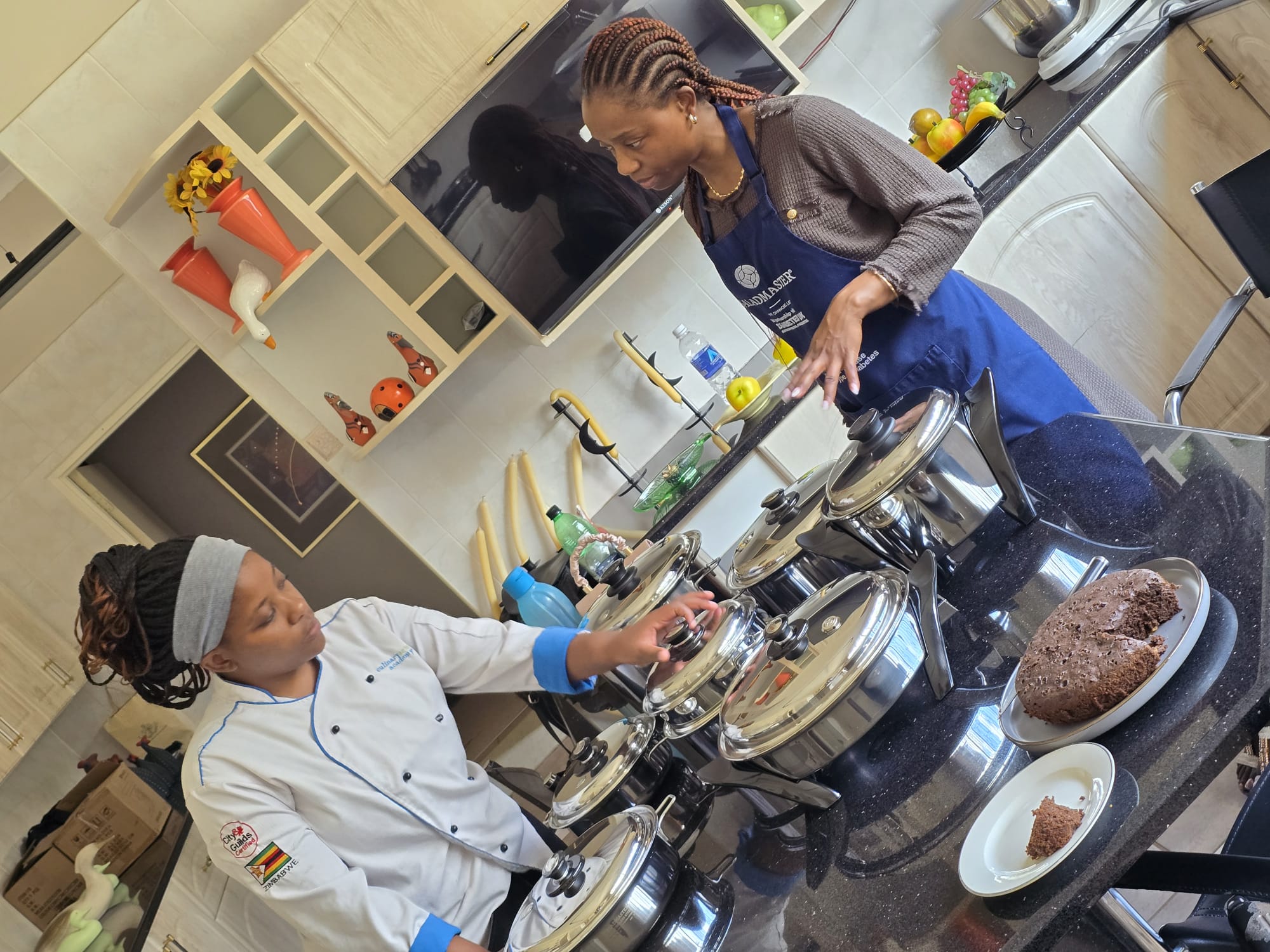 Consultant and professional chef preparing a chocolate cake on the hob in Saladmaster cookware during a live demonstration