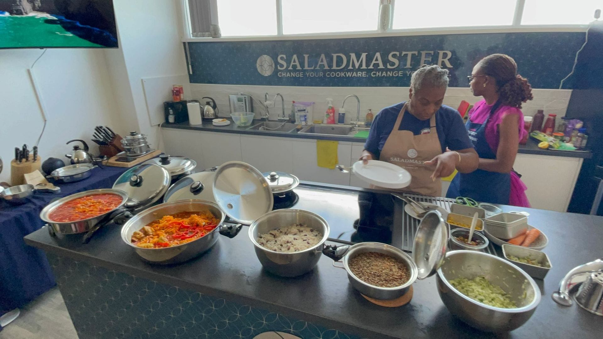 Live Saladmaster cooking class with a full spread of colourful dishes prepared in stainless steel cookware