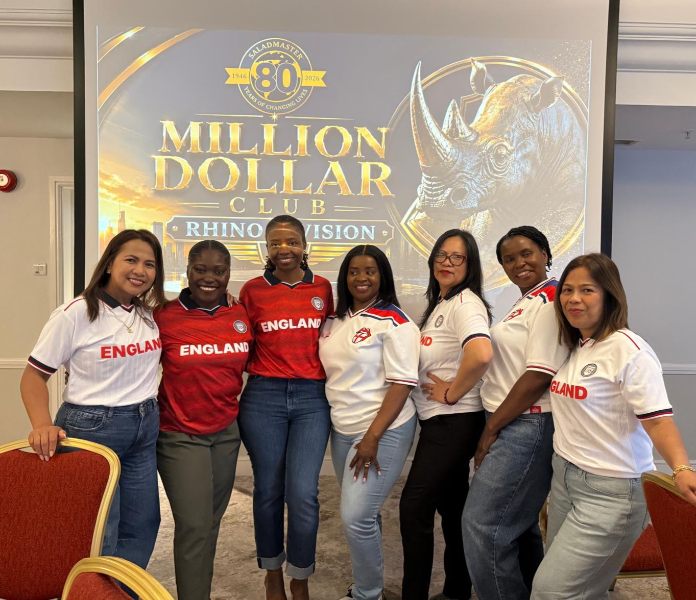 Saladmaster Million Dollar Club Rhino Division team in England jerseys at the 80 Years of Changing Lives event