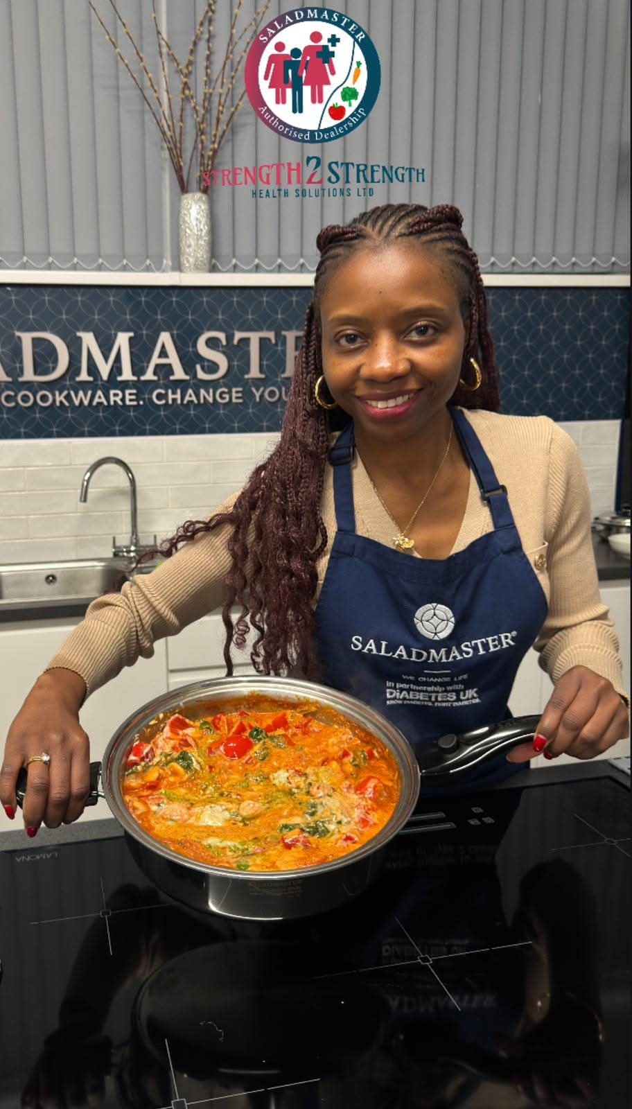 Founder cooking a healthy meal in Saladmaster apron